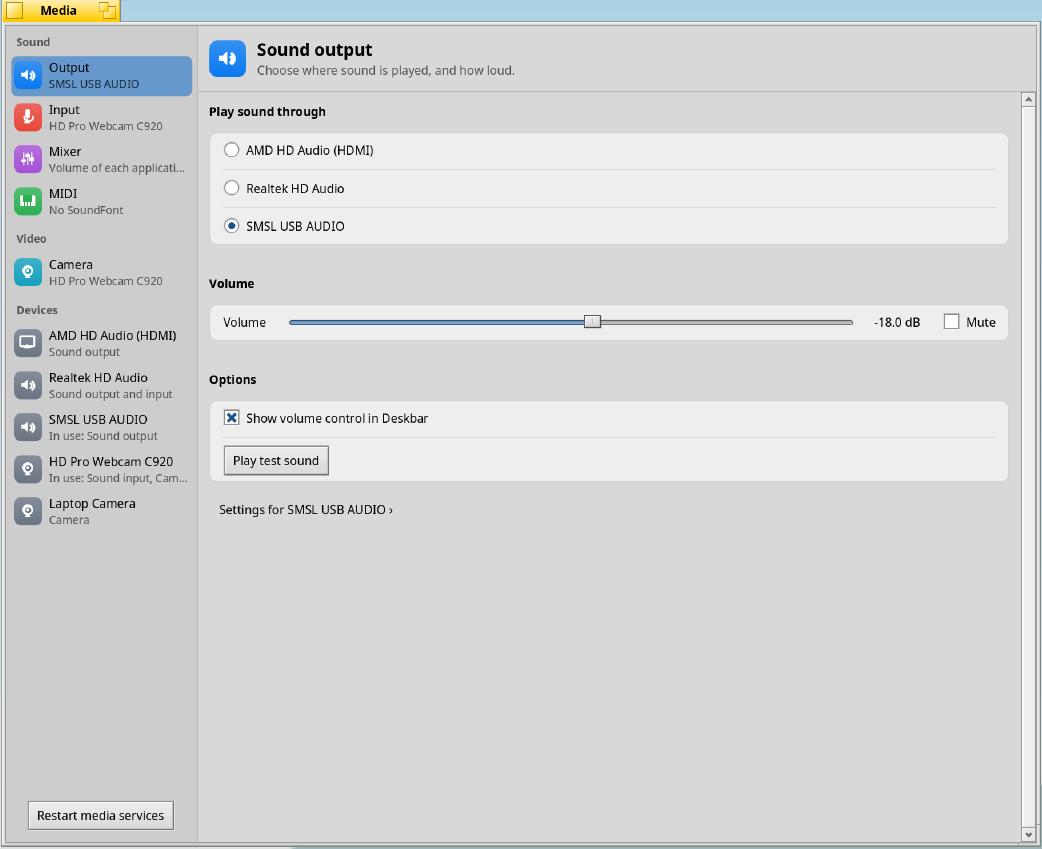Media preferences: The new sound-output page, device sidebar, volume control and test-sound action on the Framework laptop.